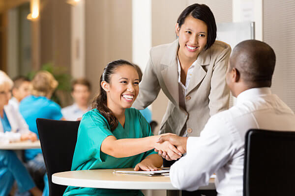 HR Leadership Training: Shaking hands with a new employee